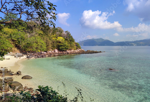 Natural landscape of a yellow sand beach in the tropics  with blue skies and azure waters