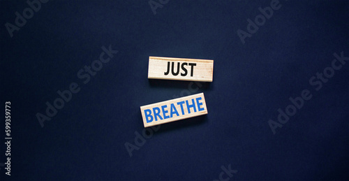 Just breathe and psychological symbol. Concept words Just breathe on beautiful wooden block. Beautiful black table black background. Business psychological and Just breathe concept. Copy space