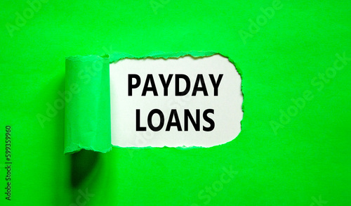 Payday loans symbol. Concept words Payday loans on beautiful white paper. Beautiful green table green background. Business and Payday loans concept. Copy space.