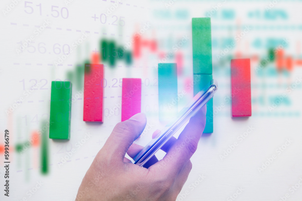 online trading on mobile phone with stock market graph online trading on mobile phone with stock market graph