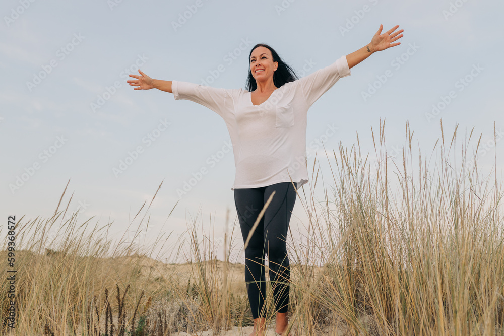 Carefree woman enjoying freedom in nature Carefree woman enjoying freedom in nature