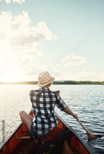 Alone on the lake. an attractive young woman spending a day kayaking on the lake. © Reese/peopleimages.com