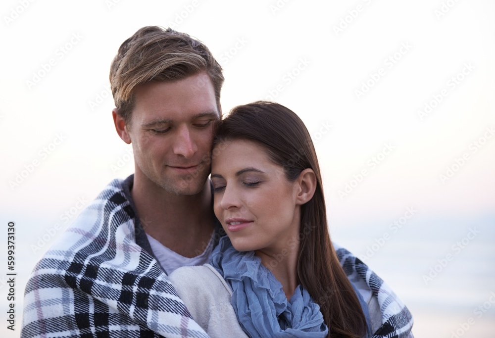 Theres nothing like young love. A young couple enjoying a romantic moment together at the beach.