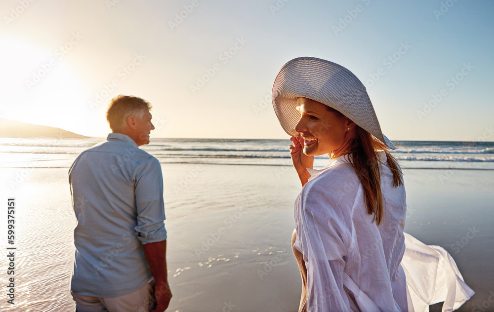 Our favorite place to be is the beach. a mature couple spending the day at the beach.