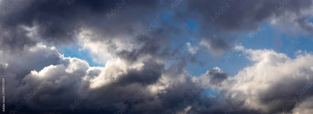 Dark dramatic sky with dark and light clouds, stormy sky