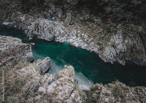 A stunning high angle view of a tranquil river winding through the rocky landscape, showcasing natures beauty and peaceful environment.