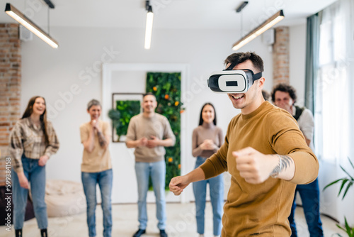 One man in front of group of friends enjoy virtual reality VR headset