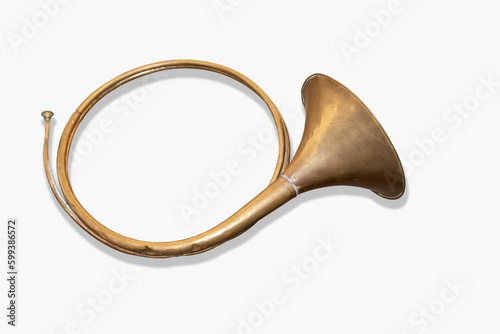 Golden antique cornu trumpet on white background, air musical instrument