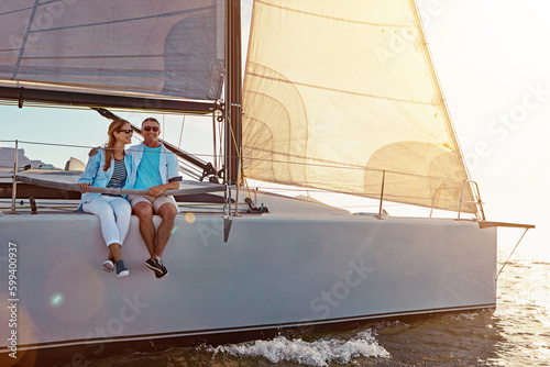This trip is just what they needed. a couple enjoying a boat cruise out on the ocean. © GR/peopleimages.com