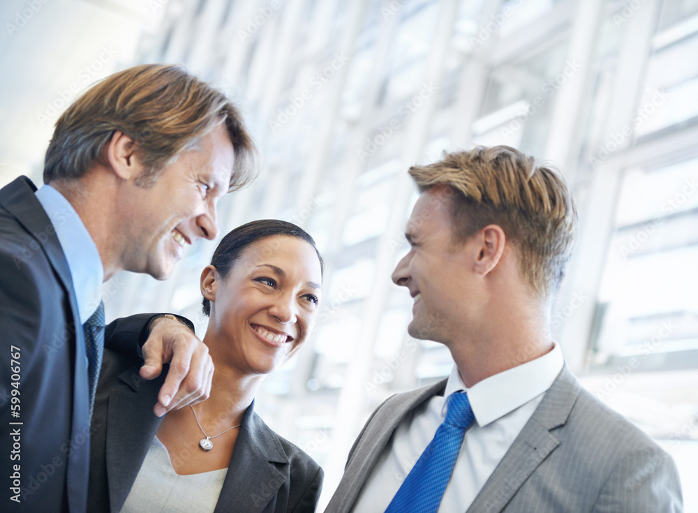 Im so relieved we finished the project on time. A group of happy businesspeople standing together. Im so relieved we finished the project on time. A group of happy businesspeople standing together.