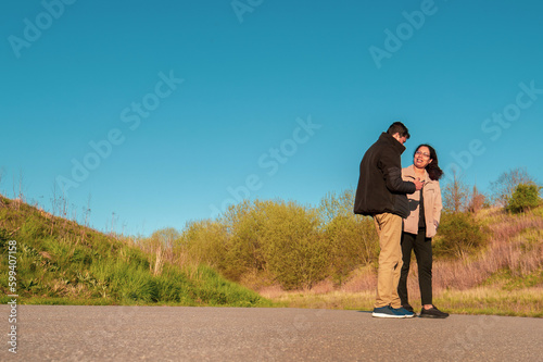 Couple standing on a road