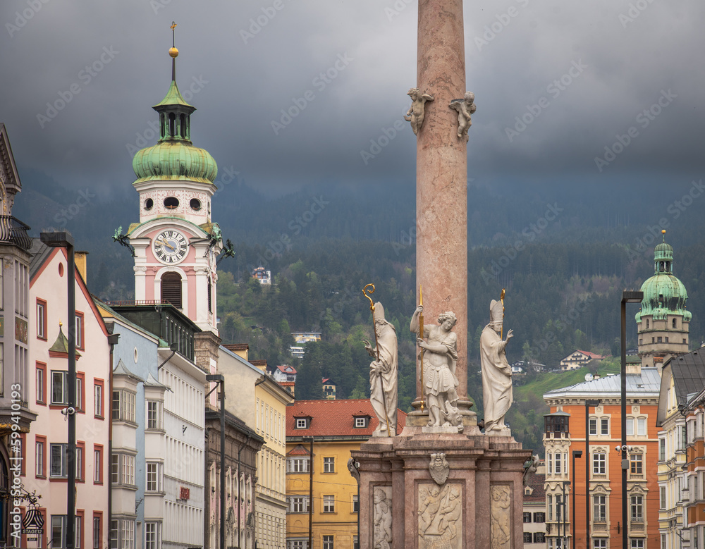 Historical architecture of Innsbruck city in Tirol, Austria with intense grey stormy clouds