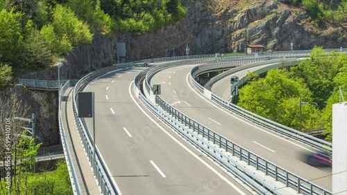 Timelapse, car traffic on the road elevated in the mountains. Highway bridge. Taubenlochschlucht, Biel/Bienne, Switzerland photo