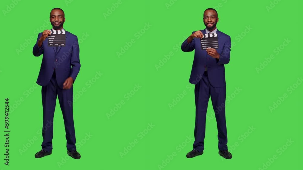 Young director using flapperboard for action in studio, working in filming and post production industry. Filmmaker using filming slate for movie making, full body green screen. Young director using flapperboard for action in studio, working in filming and post production industry. Filmmaker using filming slate for movie making, full body green screen.