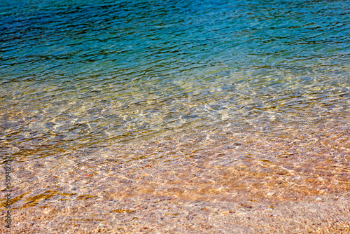 Amazing super clean sea waters close up view on Saronida private blue lagoon beach background high quality summer holidays big size instant print photo