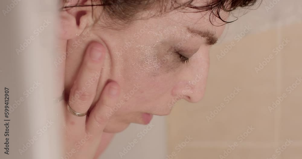Refresh your face with water. Depressed woman in the bathroom, she finds mental balance to calm down. Deep inner experiences in PMS. Refresh your face with water. Depressed woman in the bathroom, she finds mental balance to calm down. Deep inner experiences in PMS.