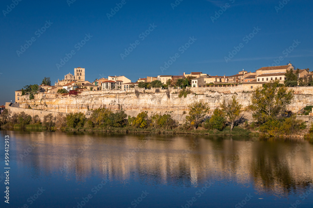 Beautiful panoramic view of Zamora cityscape during Autumn season, from the other side of the Douro River, in Spain.