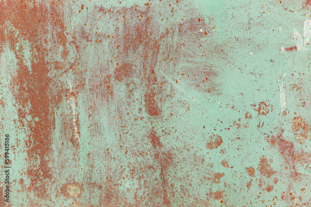 Rusty metal surface with old faded paint. Texture of rust and paint. Grunge background