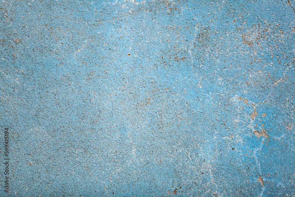 Blue concrete surface with old faded paint. Old cement texture
