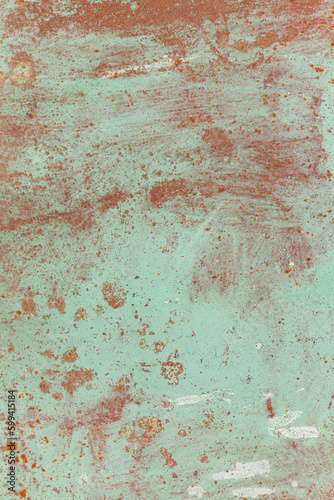 Rusty metal surface with old faded paint. Texture of rust and paint. Grunge background