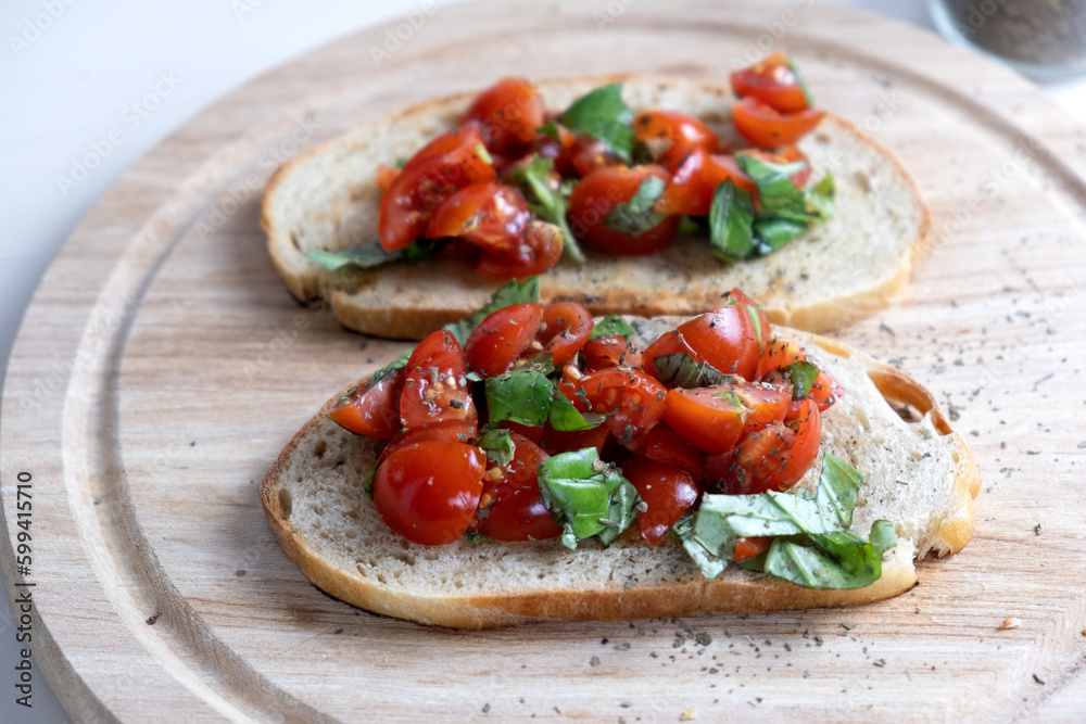Sandwiches with baked cherry tomatoes. Bruschetta with tomatoes