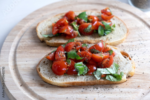 Sandwiches with baked cherry tomatoes. Bruschetta with tomatoes