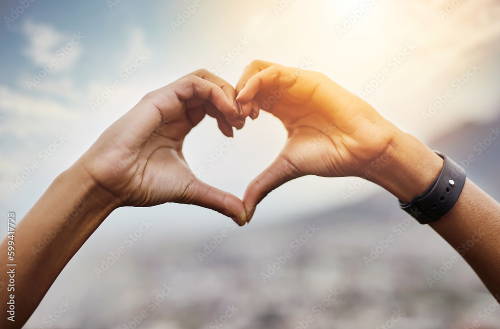 Our heart belongs to each other. Closeup shot of an unrecognizable couple making a heart shape with their hands outdoors. Our heart belongs to each other. Closeup shot of an unrecognizable couple making a heart shape with their hands outdoors.