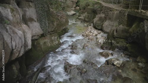 River between rocks of a narrow gorge. Stream of water is squeezed between the sides of the rocks. Taubenlochschlucht, Taubenloch Gorge, Biel/Bienne, Switzerland photo