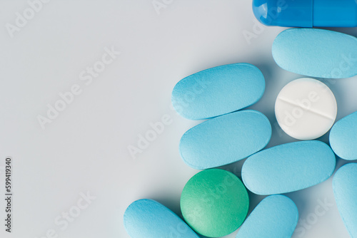 various pills on a light background, vitamins and medicine