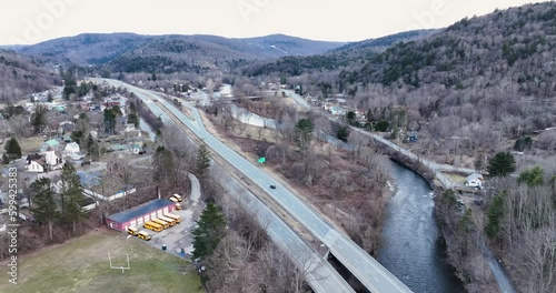 Scenic aerial view of Roscoe NY and Tree Covered Mountains in the Catskills 
