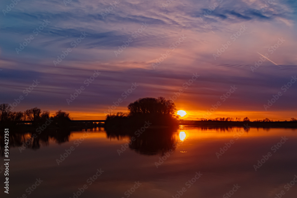 Sunset with reflections near Mettenufer, Danube, Bavaria, Germany