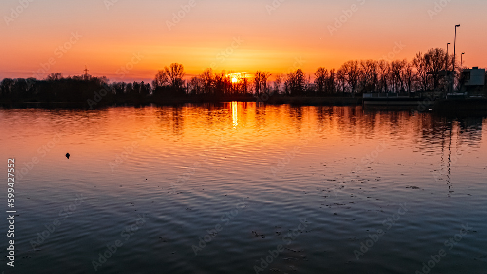 Sunset with reflections near Plattling, Isar, Bavaria, Germany
