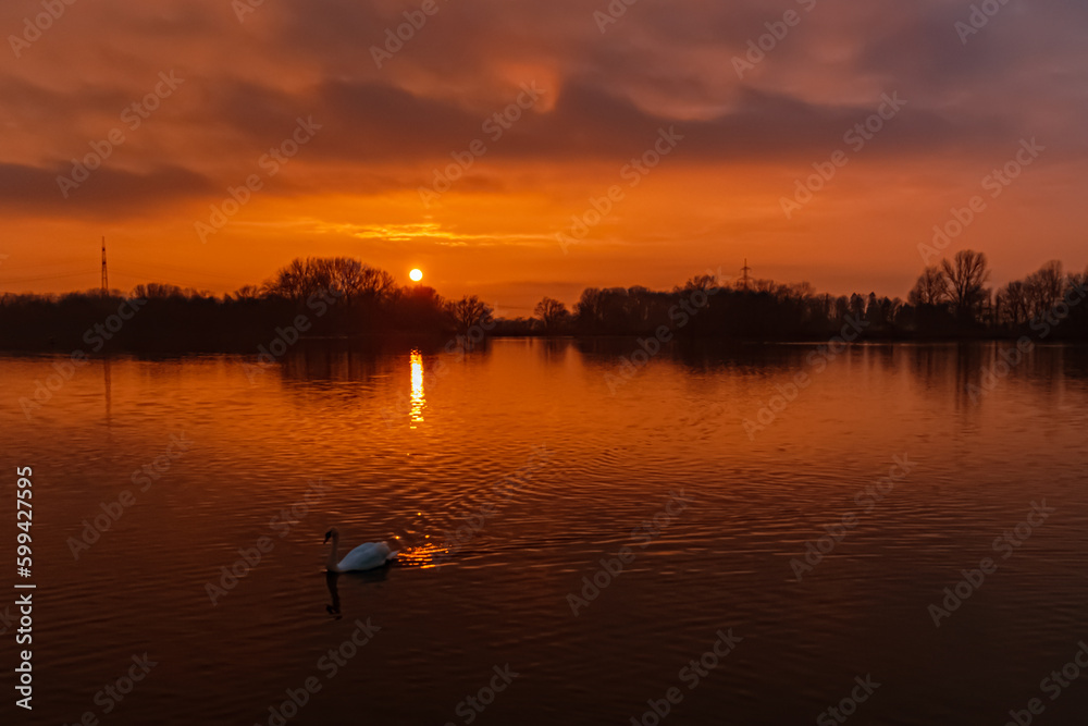 Sunset with reflections near Plattling, Isar, Bavaria, Germany Sunset with reflections near Plattling, Isar, Bavaria, Germany