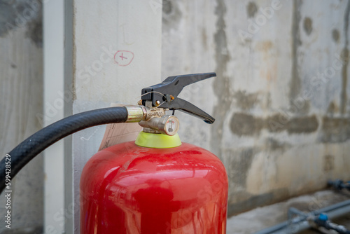 Handle of fire extinguisher for emergency fire incident. The photo is suitable to use for industry background photography, power plant poster and safety content media. photo