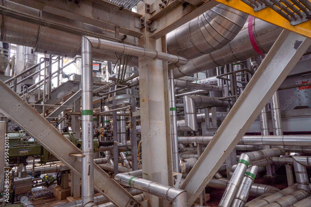 Heat recovery Steam Generator with pipe line, air intake and Up stair. The photo is suitable to use for industry background photography, power plant poster and electricity content media. Heat recovery Steam Generator with pipe line, air intake and Up stair. The photo is suitable to use for industry background photography, power plant poster and electricity content media.