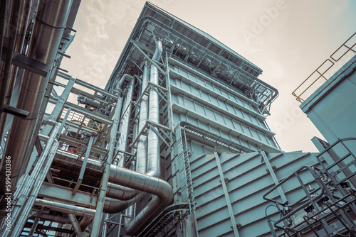 Heat recovery Steam Generator with pipe line, air intake and Up stair. The photo is suitable to use for industry background photography, power plant poster and electricity content media.