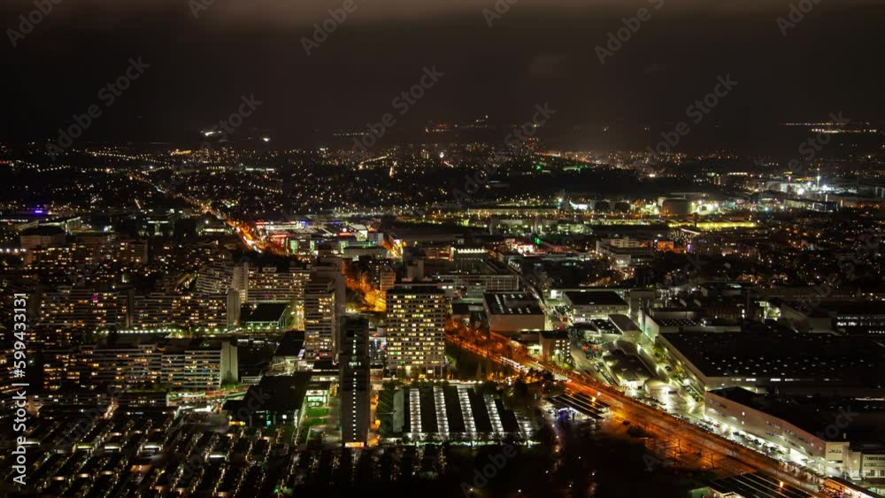 Aerial night timelapse of Munich cityscape, displaying the illuminated skyline, clouds, and Bavarian architecture in autumn. Aerial night timelapse of Munich cityscape, displaying the illuminated skyline, clouds, and Bavarian architecture in autumn.