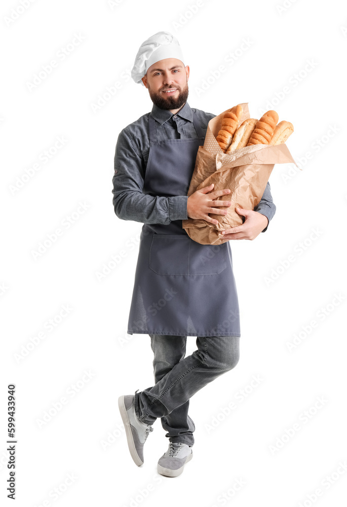 Male baker with fresh baguettes on white background Male baker with fresh baguettes on white background