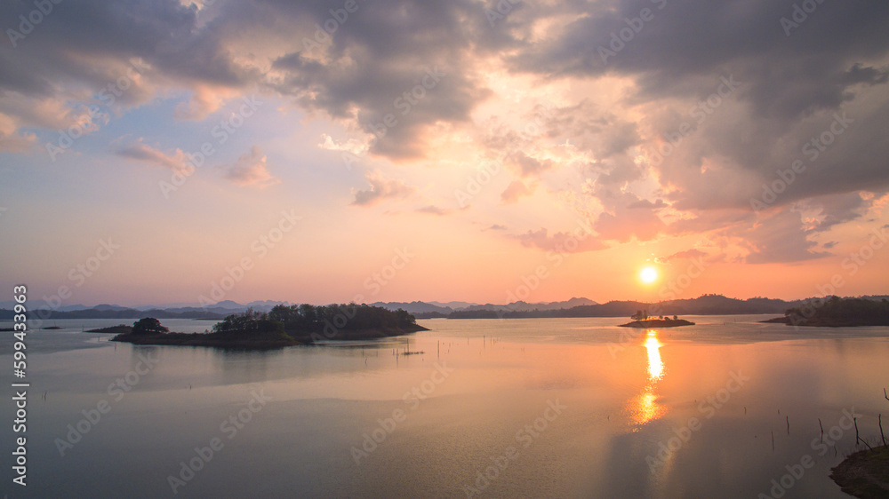 .aerial view Beautiful sky in sunset above the Lagoon..Scene of romantic beautiful sky sunset with slow moving cloud above the Lagoon..Gradient color. Sky texture, abstract nature background. . - obrazy, fototapety, plakaty 
