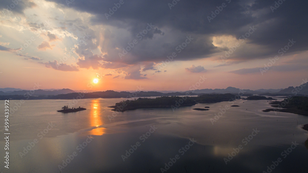 aerial view amazing sky above the lake in sunset at Pompee view point Kanchanaburi Thailand..Imagine a fantasy bright sky at sunset..Gradient color. Sky texture, abstract nature background.