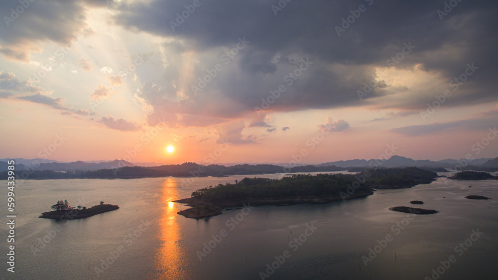aerial view amazing sky above the lake in sunset at Pompee view point Kanchanaburi Thailand..Imagine a fantasy bright sky at sunset..Gradient color. Sky texture, abstract nature background.