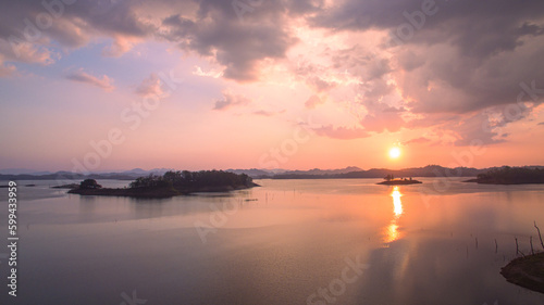 .aerial view Beautiful sky in sunset above the Lagoon..Scene of romantic beautiful sky sunset with slow moving cloud above the Lagoon..Gradient color. Sky texture, abstract nature background. . © Narong Niemhom
