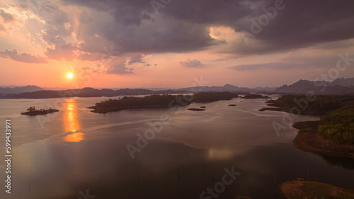 aerial view amazing sky above the lake in sunset at Pompee view point Kanchanaburi Thailand..Imagine a fantasy bright sky at sunset..Gradient color. Sky texture, abstract nature background.