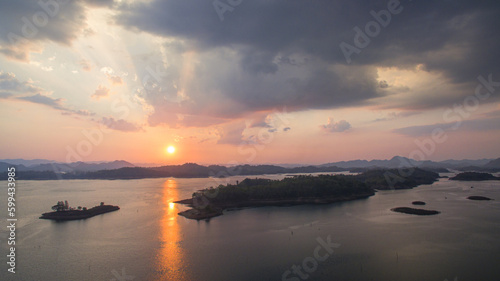 aerial view amazing sky above the lake in sunset at Pompee view point Kanchanaburi Thailand..Imagine a fantasy bright sky at sunset..Gradient color. Sky texture, abstract nature background.