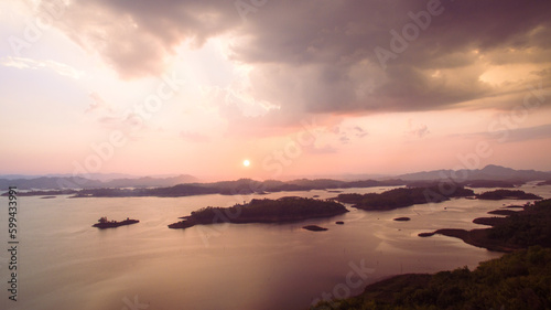 aerial view amazing sky above the lake in sunset at Pompee view point Kanchanaburi Thailand..Imagine a fantasy bright sky at sunset..Gradient color. Sky texture, abstract nature background.