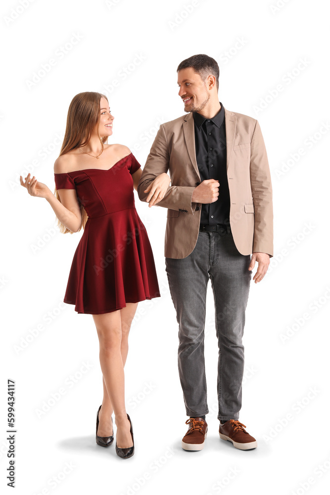 Elegant young couple walking hand in hand on white background Elegant young couple walking hand in hand on white background