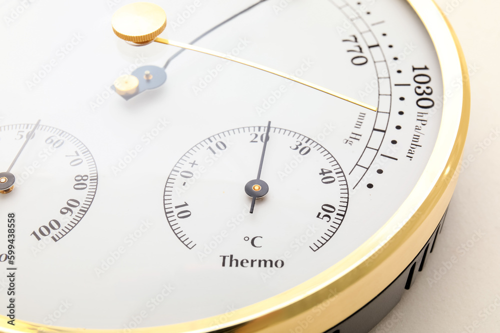 Aneroid barometer on white background, closeup Aneroid barometer on white background, closeup
