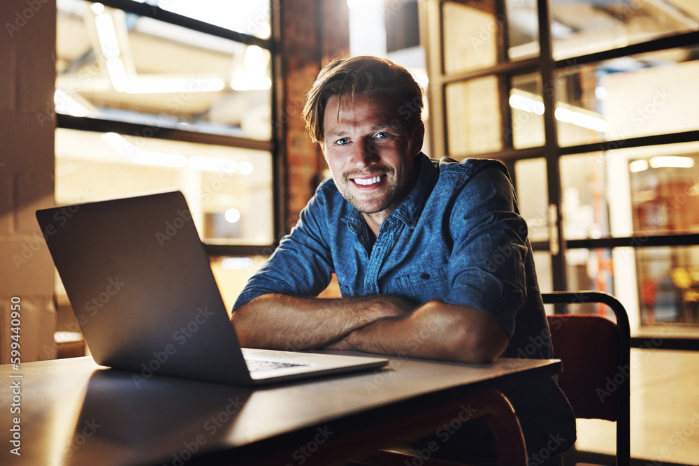 Im on top of all of my targets. Cropped portrait of a handsome young male designer looking pleased while working late in his office. Im on top of all of my targets. Cropped portrait of a handsome young male designer looking pleased while working late in his office.