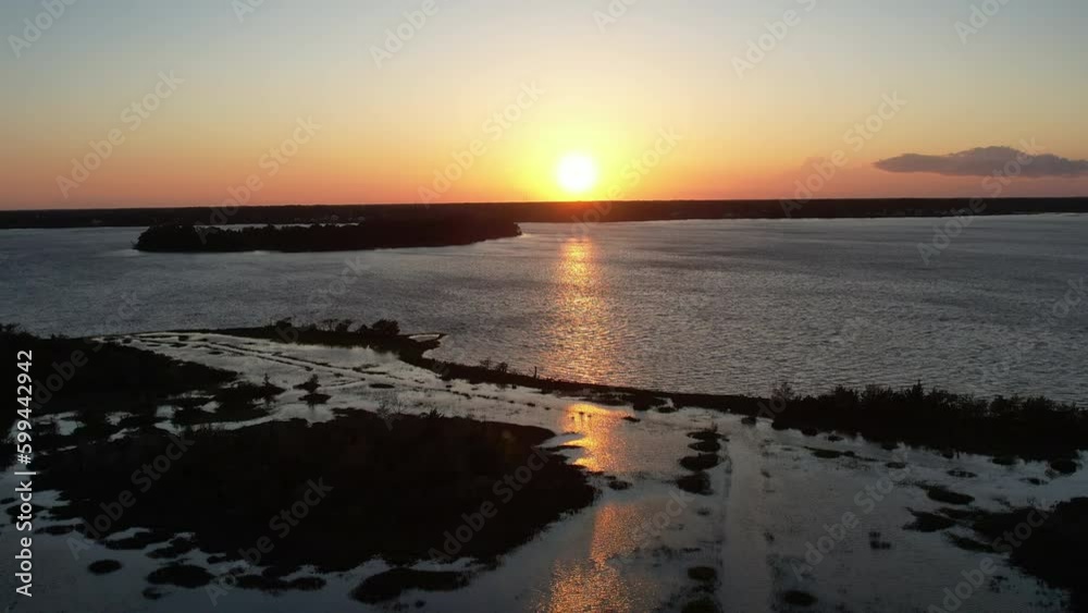 Drone shot of the salt marsh or wetlands, aerial shot into the sun