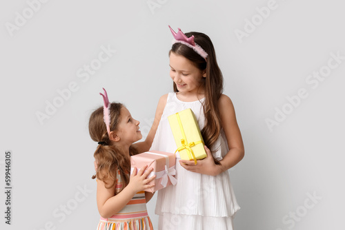 Little girls with gifts on ...